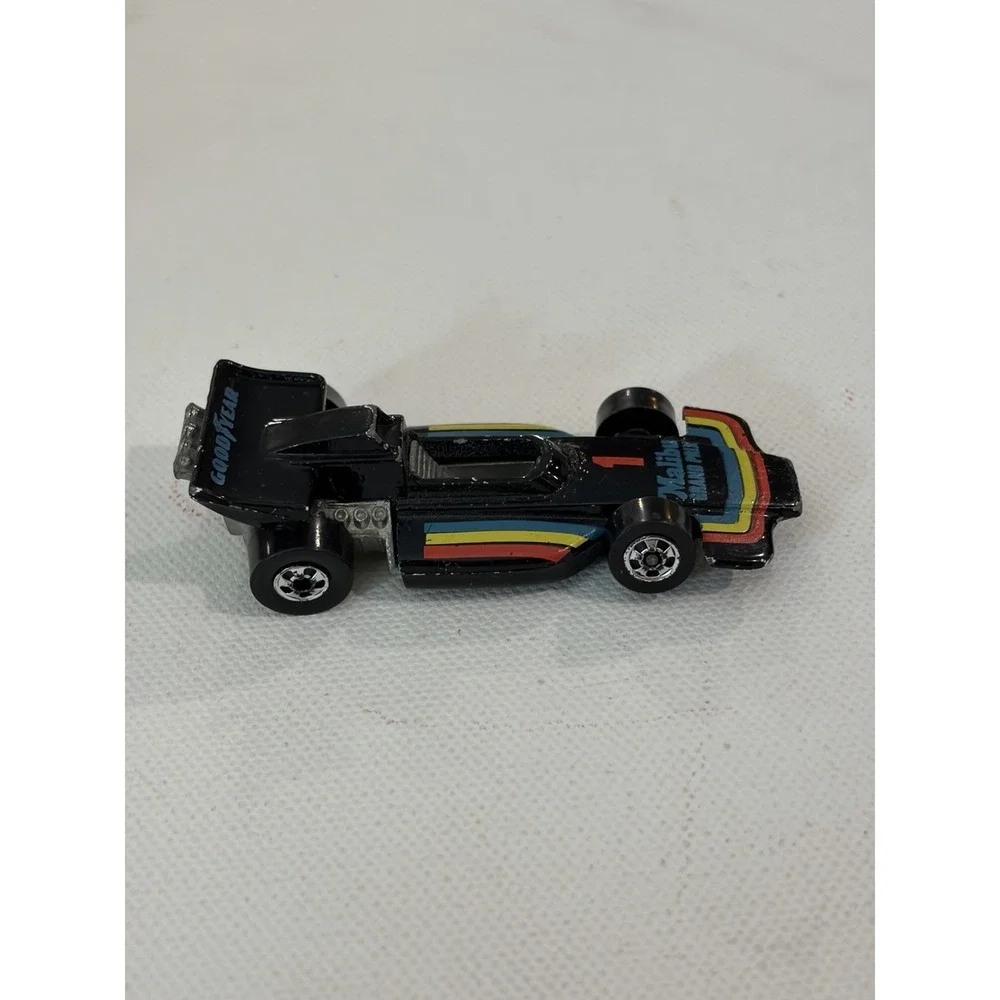 1982 Hot Wheels Malibu Grand Prix 1973 Malaysia Blackwalls Metal Base Black #1